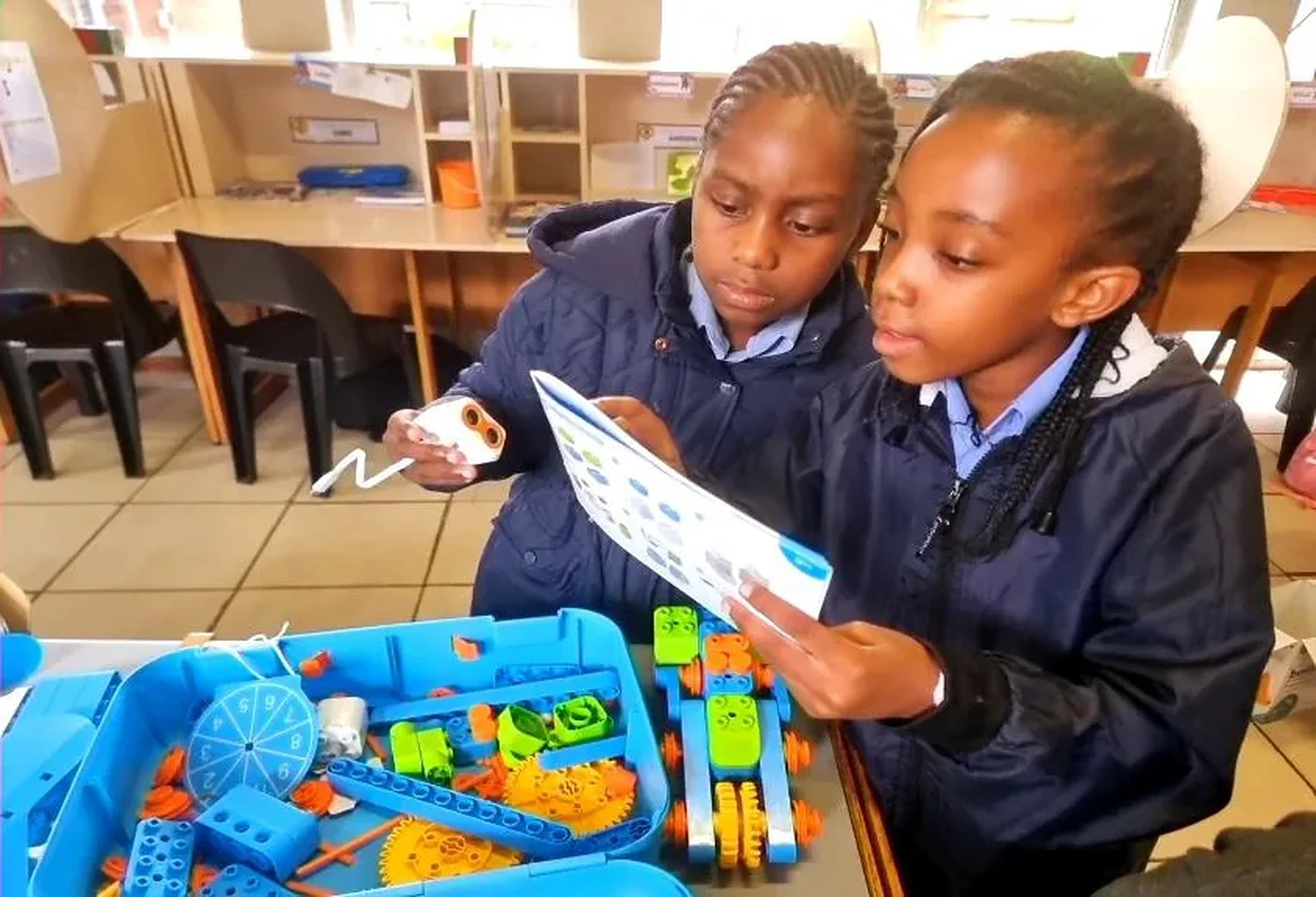 Learners collaborating on a practical STEAM and robotics project