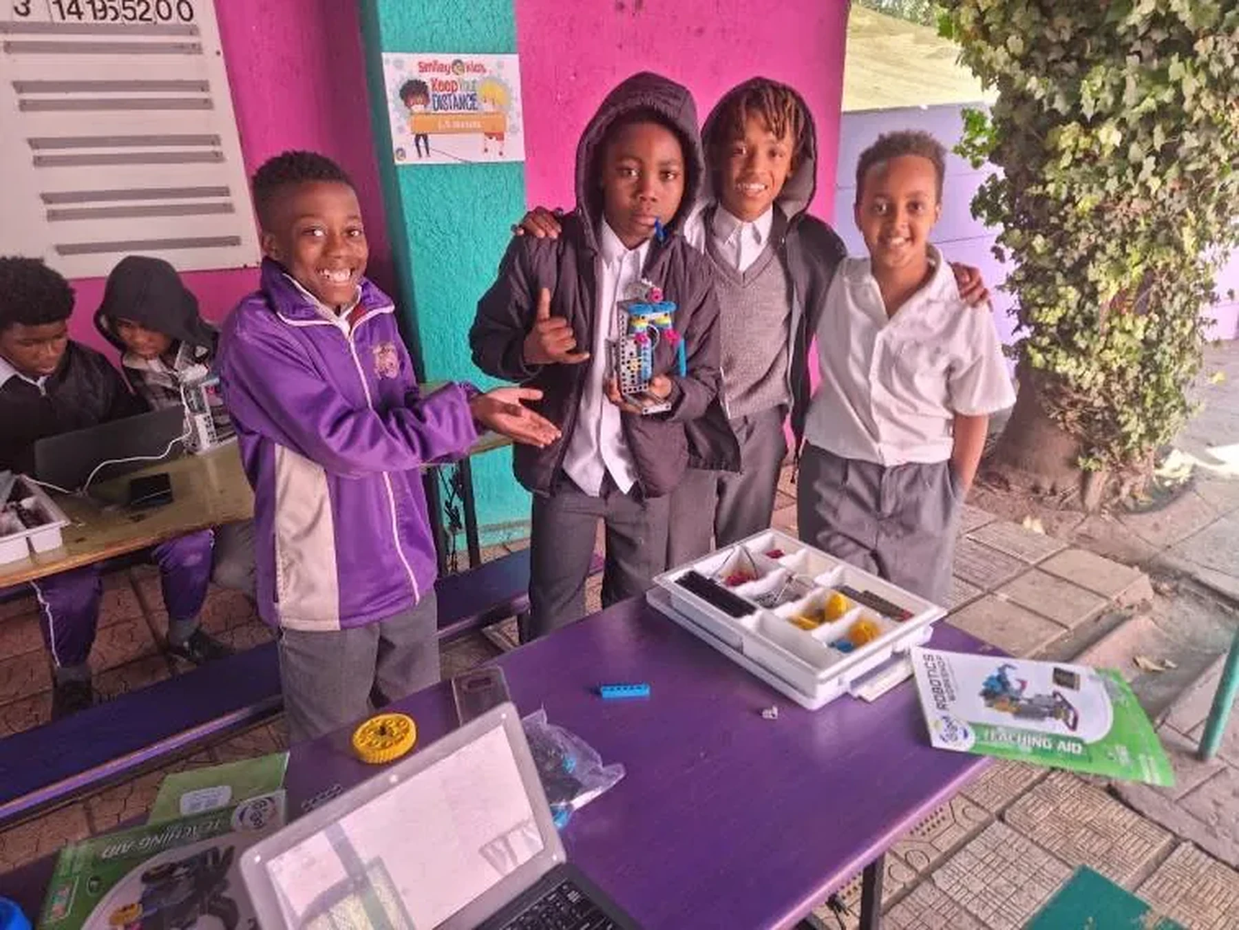 Young people demonstrating technology projects in a community setting