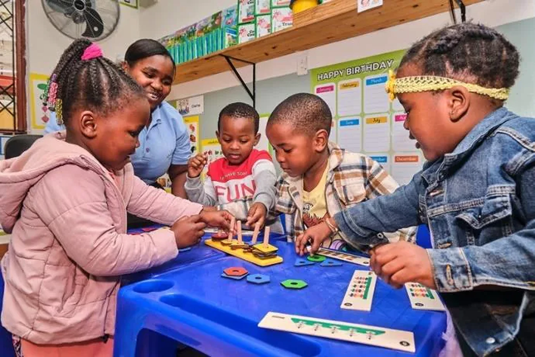 Young children and an educator learning together