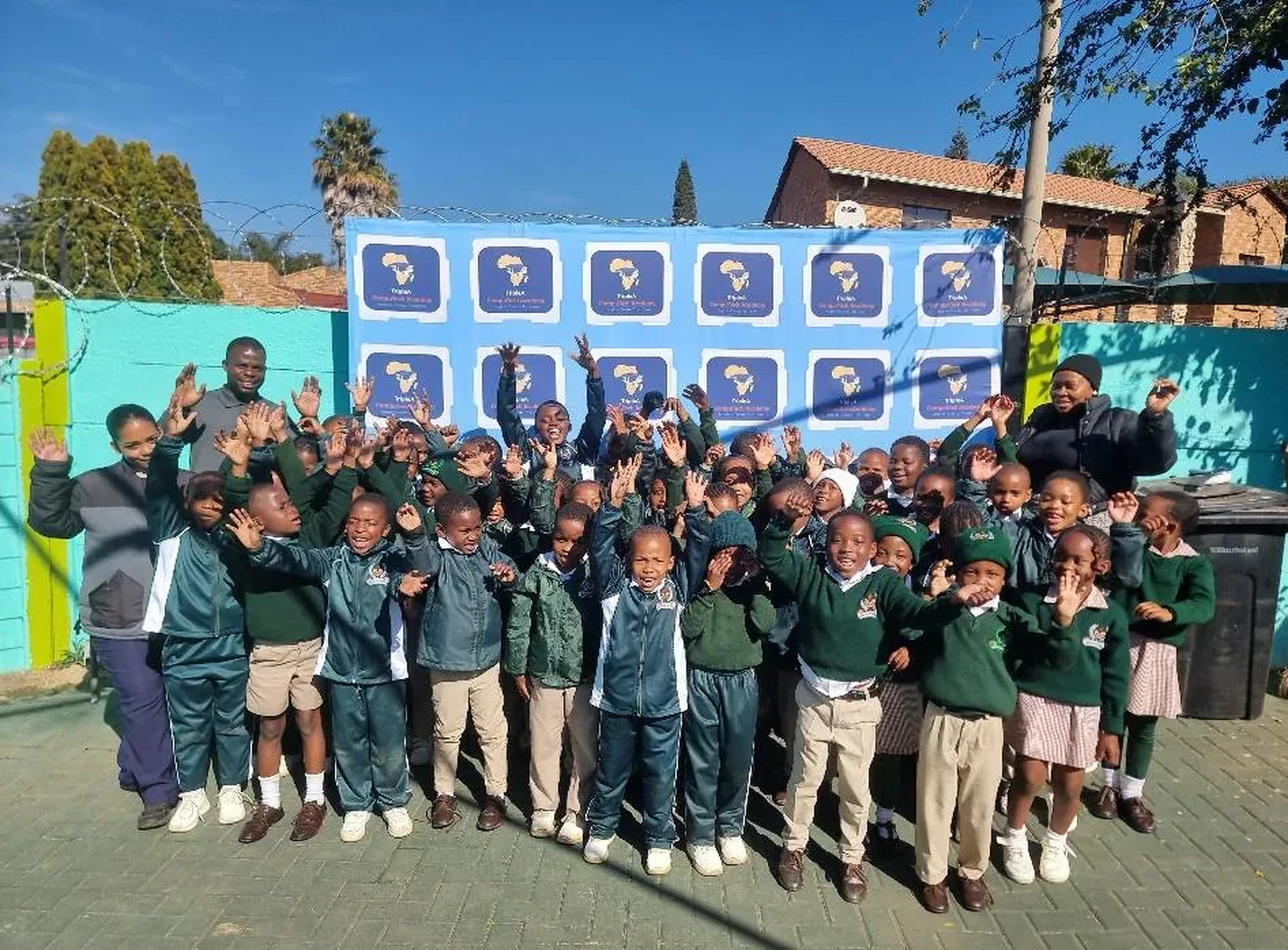 Learners celebrating participation in a robotics club